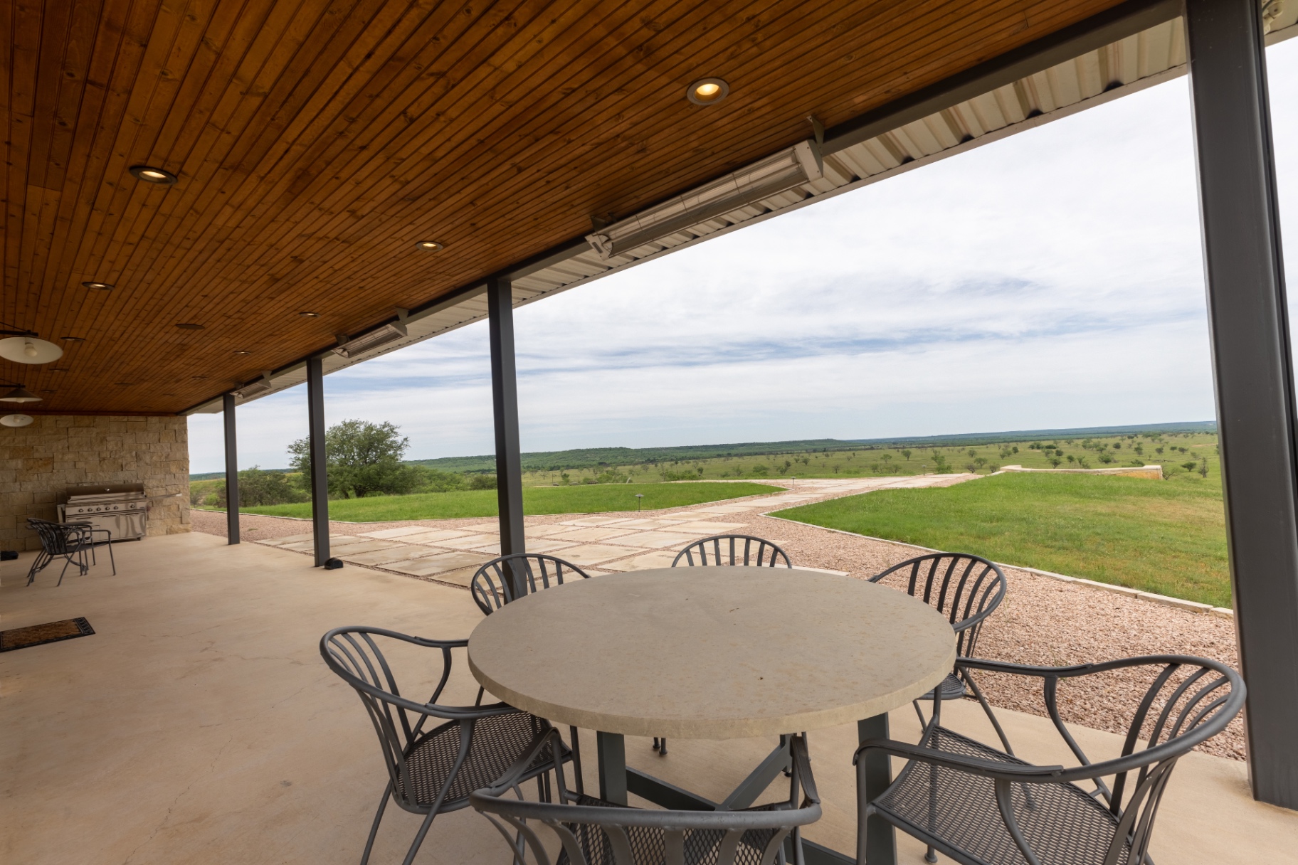 Guest House patio dining table with open ranch views — Trinity Valley Ranch Deer, Coleman Texas