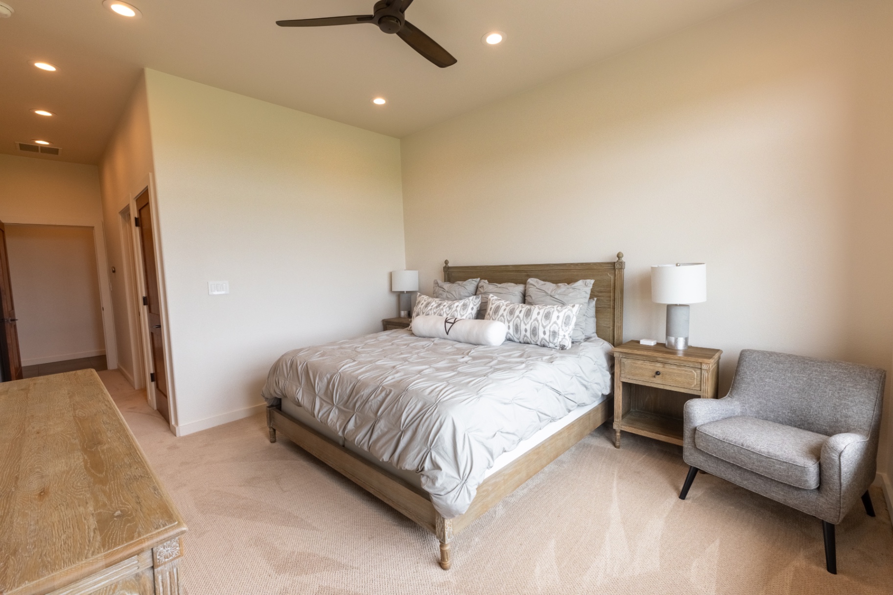 Guest House master bedroom with sitting area and ranch views — Trinity Valley Ranch Deer, Coleman Texas