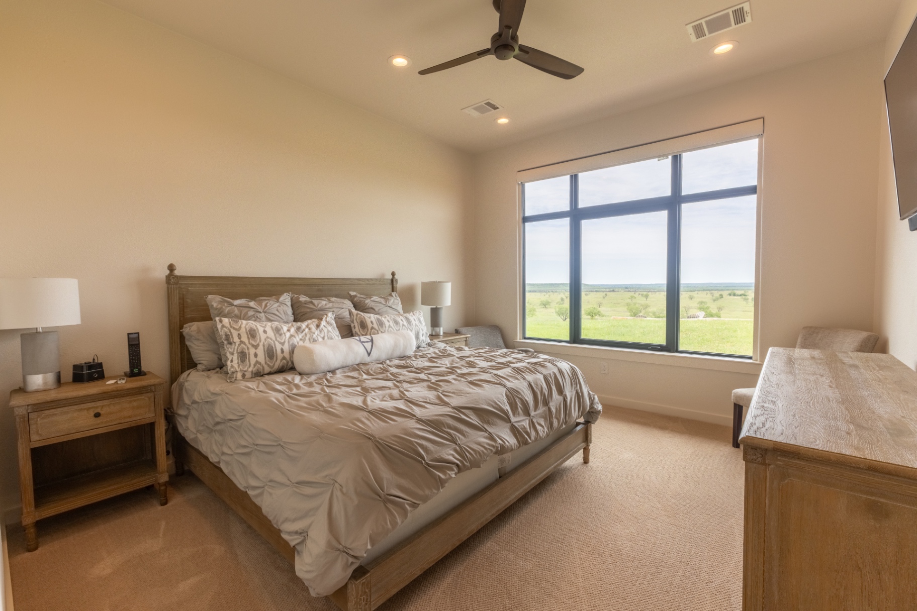 Guest House king bedroom with panoramic ranch views — Trinity Valley Ranch Deer, Coleman Texas