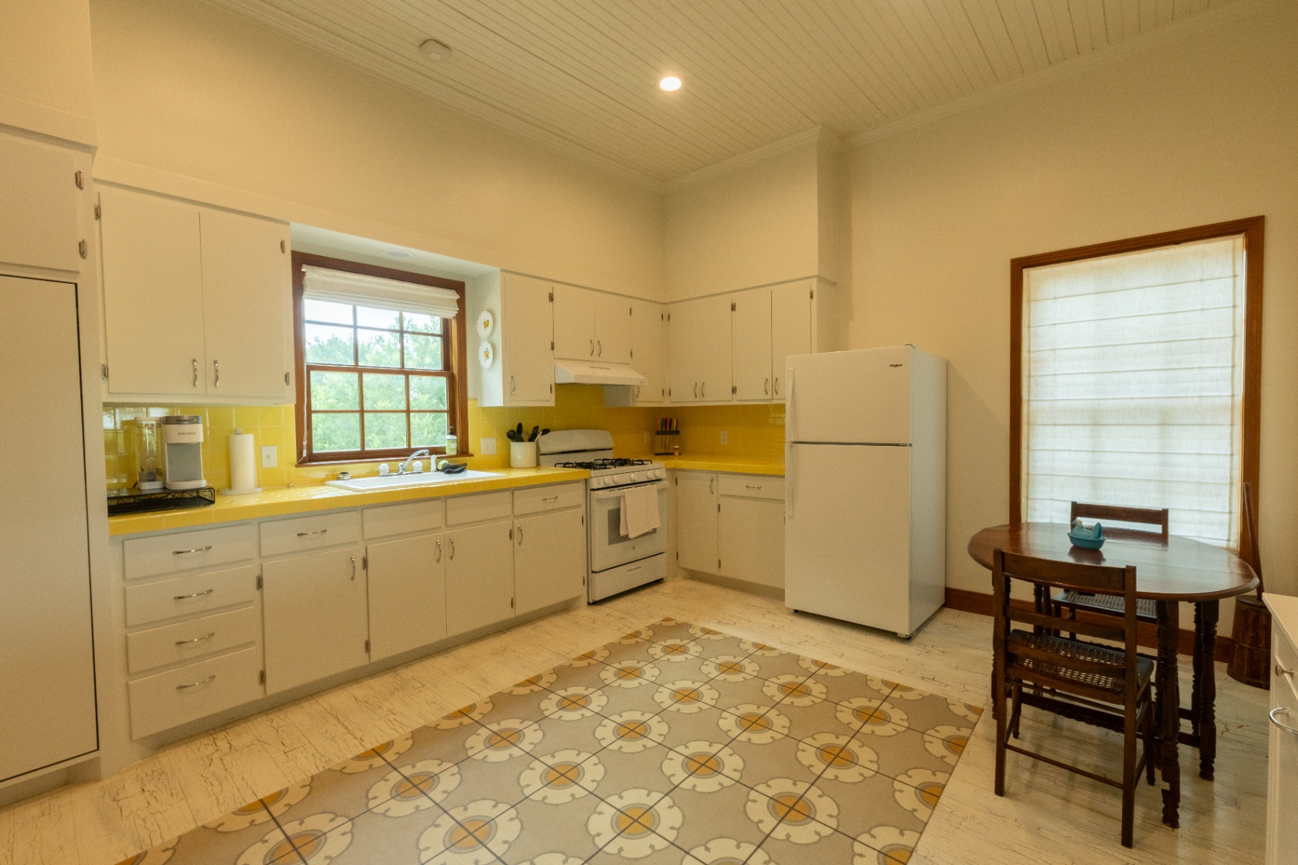 Farm House vintage kitchen with yellow tile counters and gas range — Trinity Valley Ranch Deer, Coleman Texas