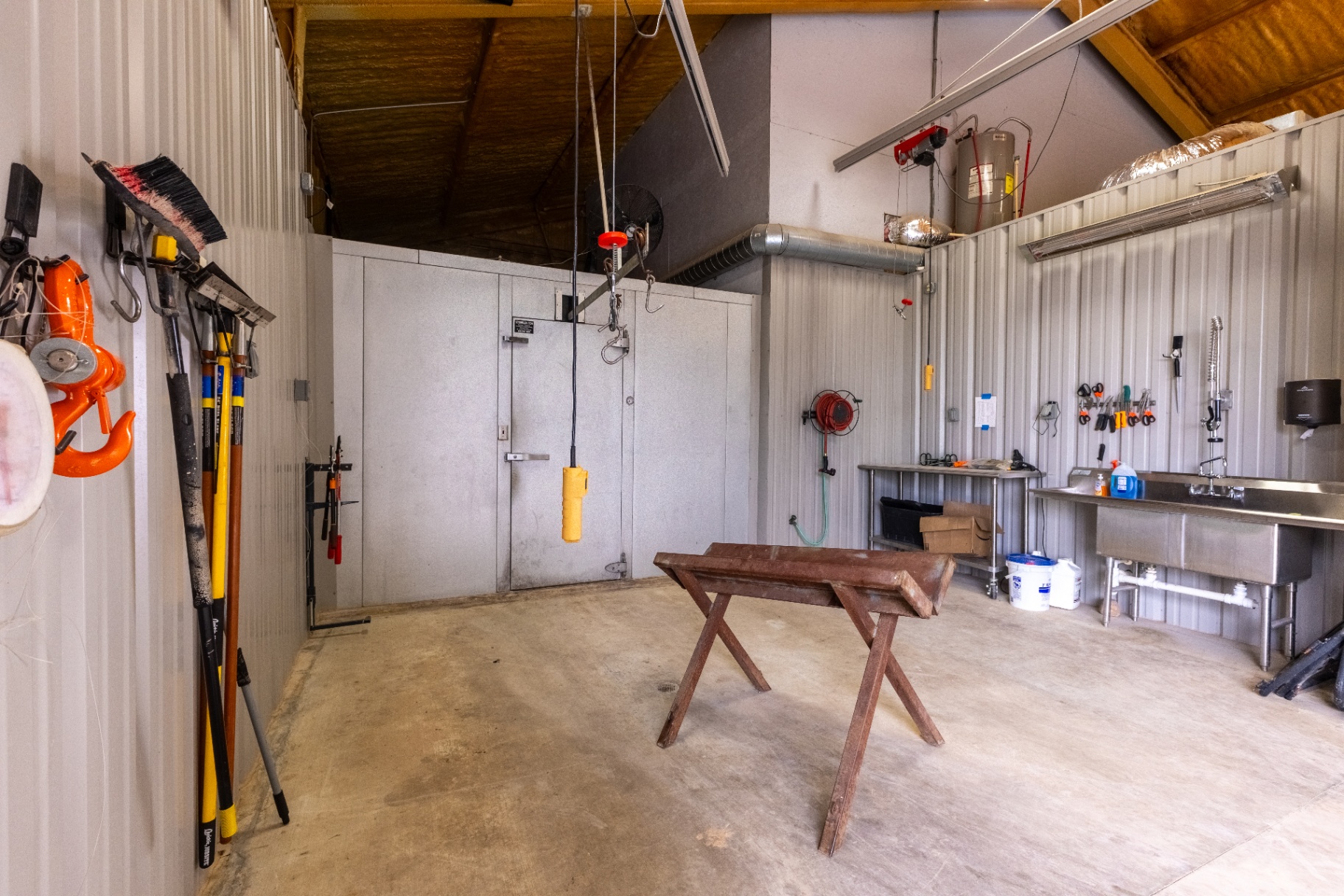 On-site game processing room with cooler and prep station